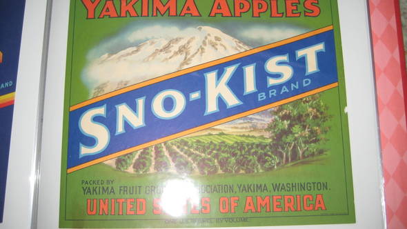 Snokist Green next to latest version Fruit Crate Label