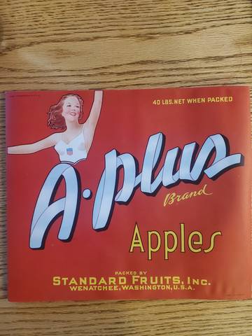 A Plus Red Label is wavy Fruit Crate Label